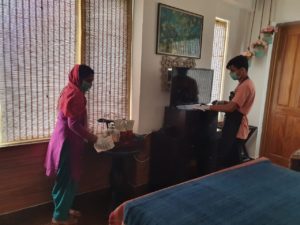 Staff sanitizing common areas